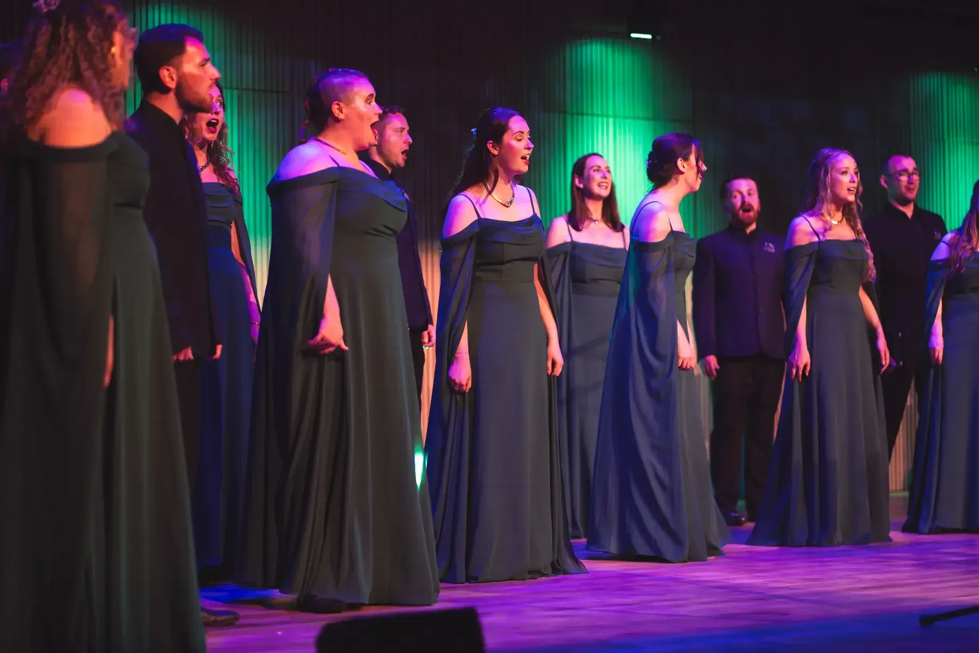LORICA singers performing under violet stage light